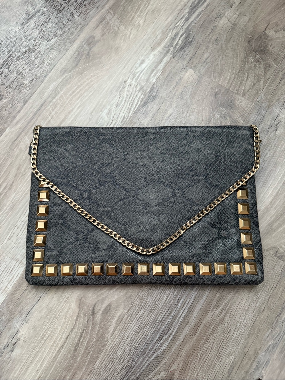 Gray clutch with gold studs